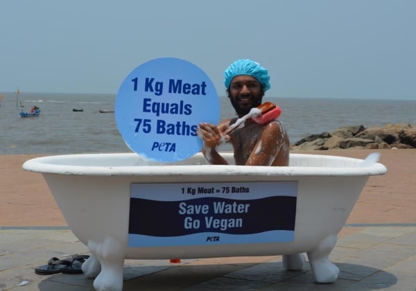 PHOTOS: Man Takes Public Bath for Earth Day